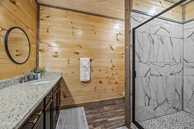 2125 Eagle Feather Dr, Sevierville, TN 37876 - bathroom featuring vanity, a stall shower, and wooden walls