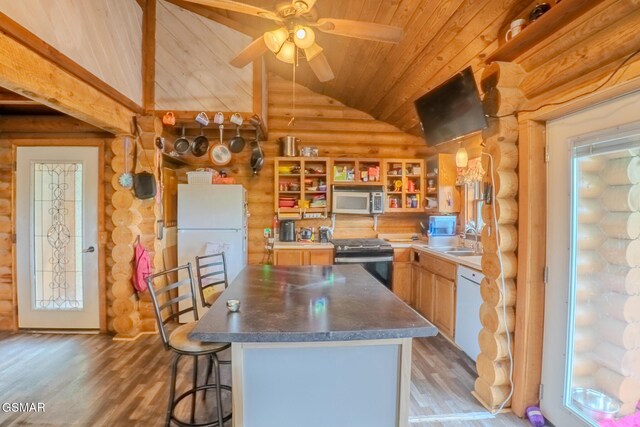 731 Pleasant Grove Rd, Winfield, TN 37892 - kitchen with log walls, appliances with stainless steel finishes, vaulted ceiling, wooden ceiling, and a center island