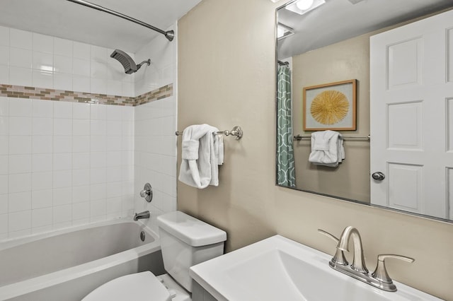 full bathroom with shower / tub combo with curtain, vanity, and toilet