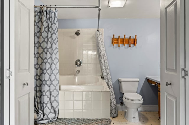 bathroom featuring shower / bath combo and toilet