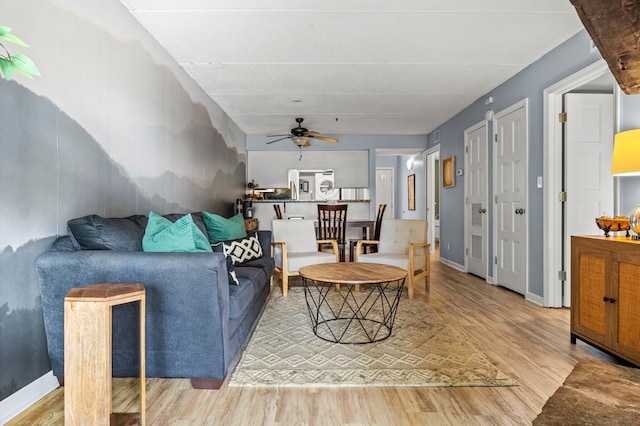 living room with hardwood / wood-style flooring and ceiling fan