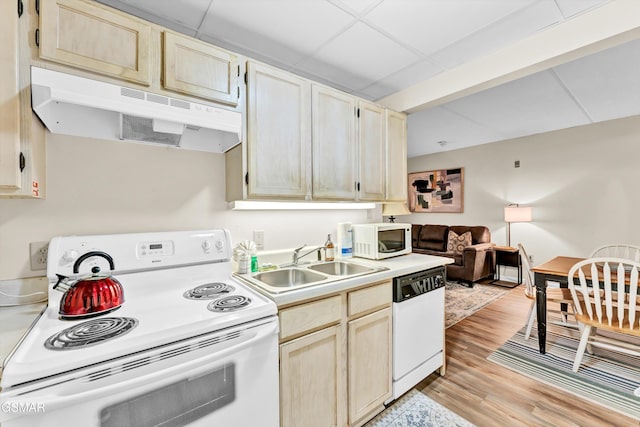 413 Baskins Creek Rd Unit 205, Gatlinburg, TN 37738 - kitchen with white appliances, under cabinet range hood, a sink, light countertops, and light wood-style floors