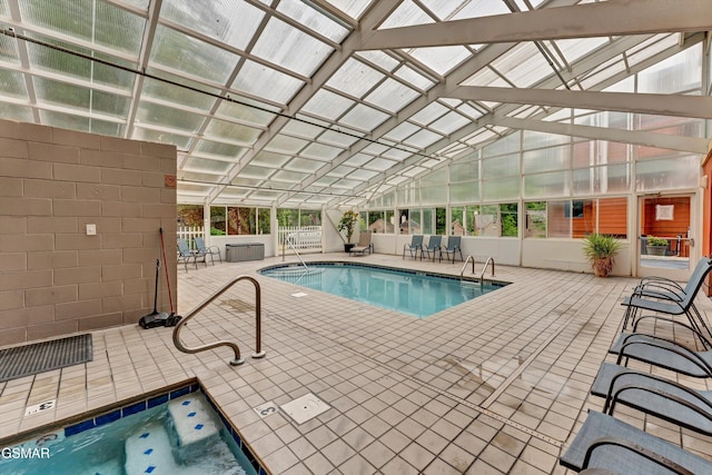 413 Baskins Creek Rd Unit 205, Gatlinburg, TN 37738 - indoor community pool featuring an in-ground hot tub and a patio area