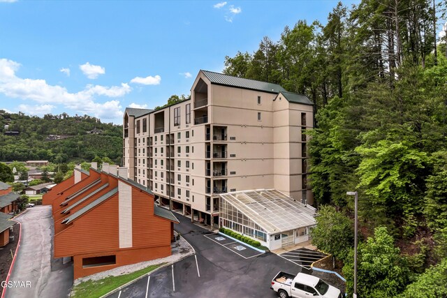 413 Baskins Creek Rd Unit 205, Gatlinburg, TN 37738 - view of property with uncovered parking