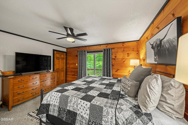 380 Laurel Rd, Townsend, TN 37882 - bedroom with a textured ceiling, carpet floors, a ceiling fan, and wood walls