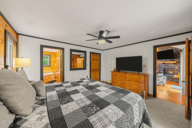 380 Laurel Rd, Townsend, TN 37882 - bedroom featuring crown molding, a fireplace, carpet flooring, ceiling fan, and ensuite bath