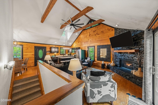 380 Laurel Rd, Townsend, TN 37882 - living room featuring wood walls, wood finished floors, ceiling fan, a fireplace, and recessed lighting