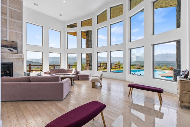 3661 Richardson Cove Rd, Sevierville, TN 37876 - living room featuring a mountain view, a towering ceiling, and a fireplace