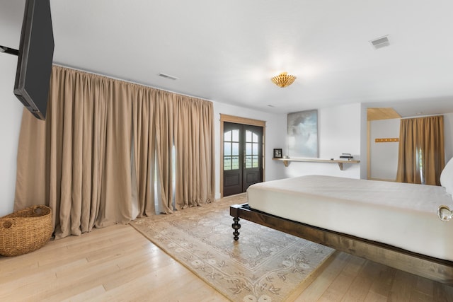 3661 Richardson Cove Rd, Sevierville, TN 37876 - bedroom featuring french doors and wood-type flooring