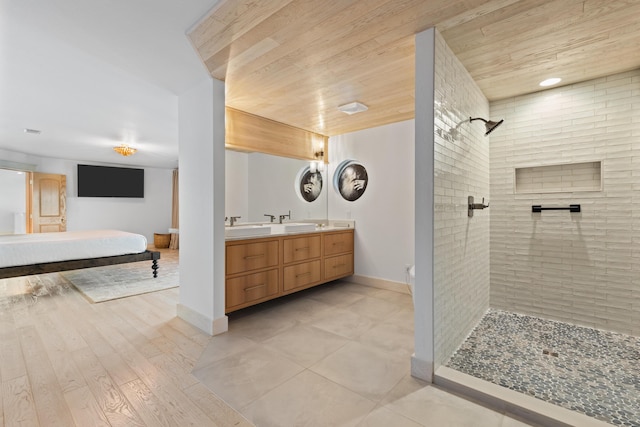 3661 Richardson Cove Rd, Sevierville, TN 37876 - bathroom with hardwood / wood-style flooring, vanity, wood ceiling, and tiled shower