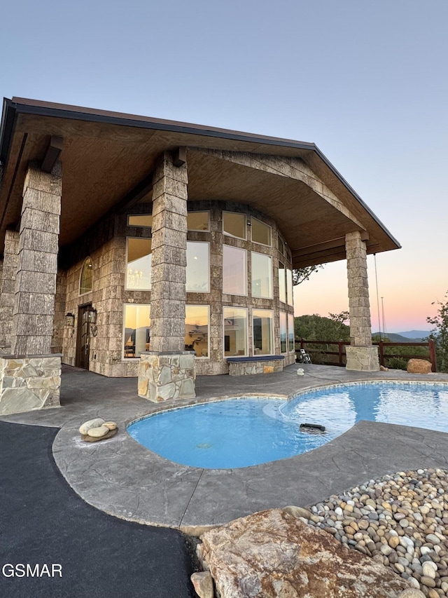 3661 Richardson Cove Rd, Sevierville, TN 37876 - pool at dusk featuring a patio area