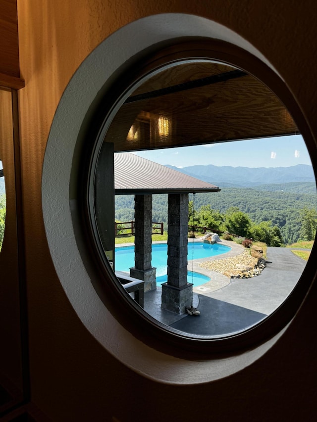 3661 Richardson Cove Rd, Sevierville, TN 37876 - exterior details featuring a mountain view and a swimming pool
