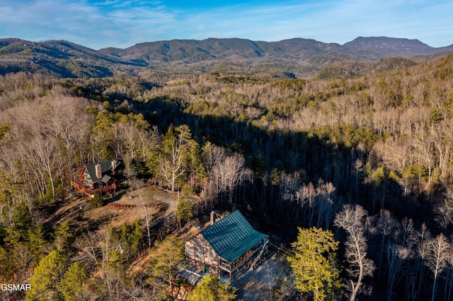 bird's eye view with a mountain view and a wooded view