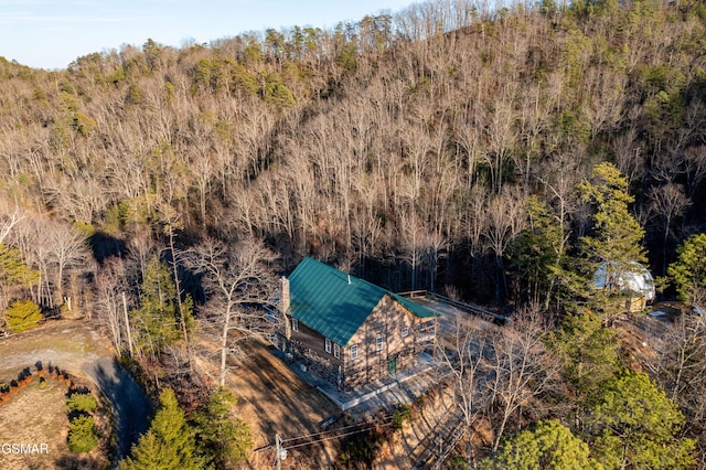 drone / aerial view featuring a forest view