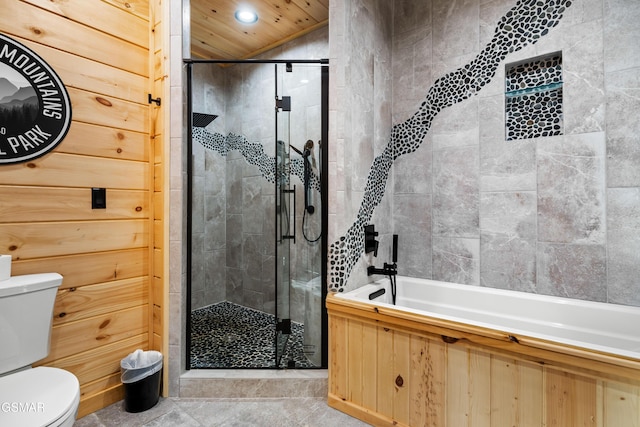 bathroom featuring recessed lighting, toilet, a bath, and a shower stall