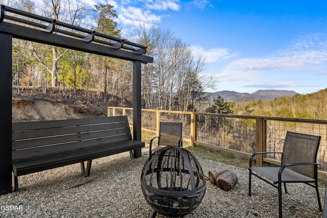 view of yard with a fire pit and a mountain view