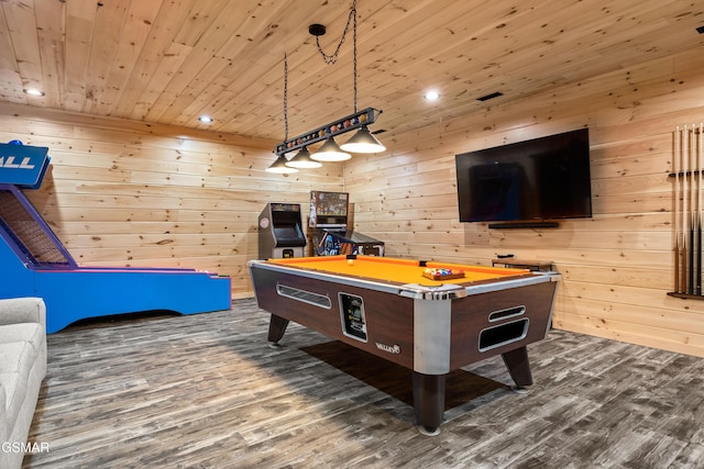 game room featuring recessed lighting, dark wood-type flooring, wood ceiling, and wooden walls