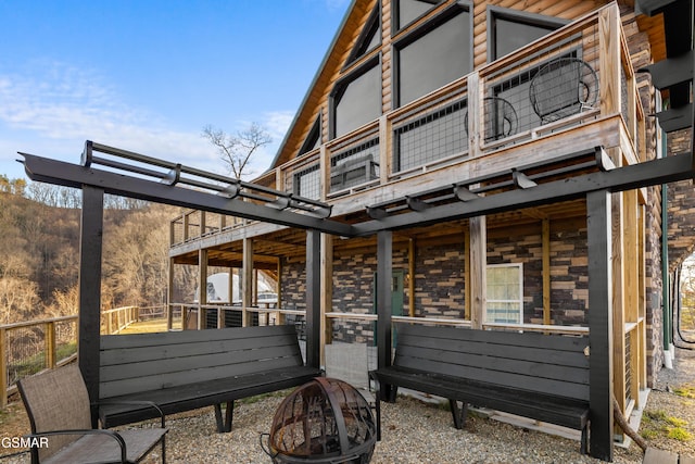 exterior space with an exterior structure, an outbuilding, and a fire pit