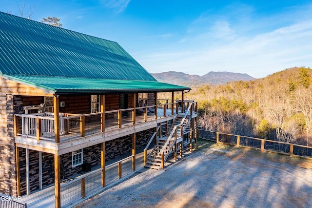 view of dock featuring a mountain view and stairway