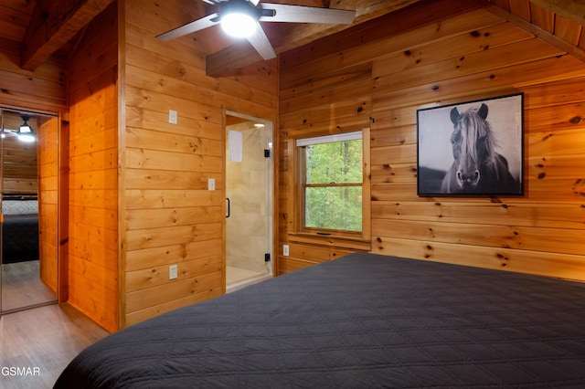 2069 Little Creek Way, Sevierville, TN 37862 - bedroom with wooden walls, wood finished floors, and beam ceiling