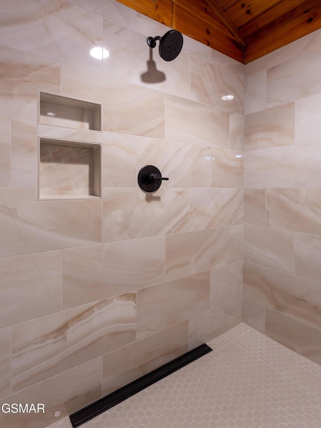 2069 Little Creek Way, Sevierville, TN 37862 - bathroom featuring a tile shower and vaulted ceiling