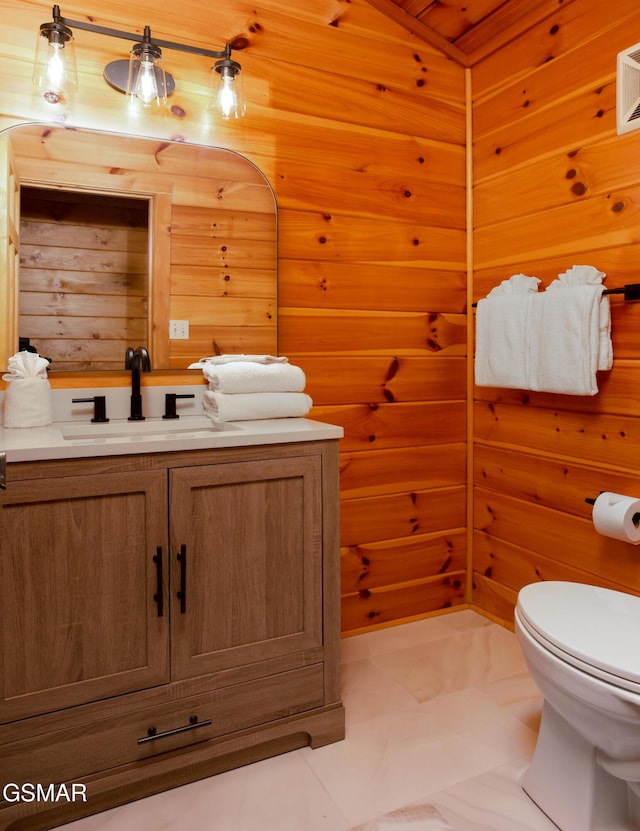 2069 Little Creek Way, Sevierville, TN 37862 - bathroom with vanity, toilet, and wood walls