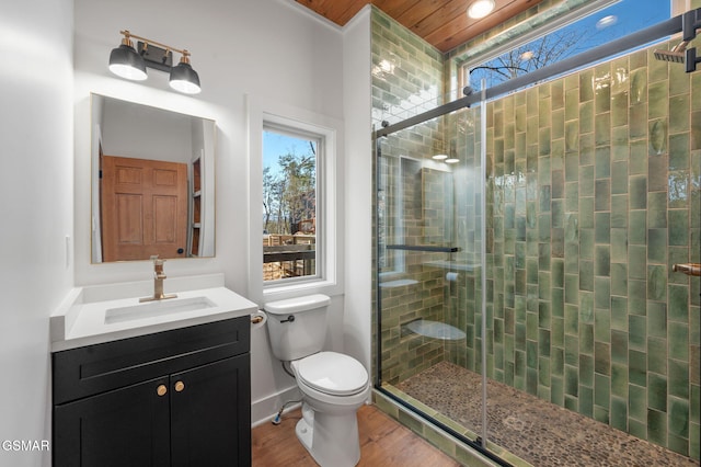 2385 Forge Hideaway Loop Unit 4, Pigeon Forge, TN 37863 - bathroom featuring toilet, a stall shower, wood finished floors, vanity, and wood ceiling