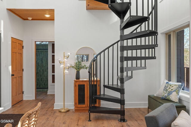 2385 Forge Hideaway Loop Unit 4, Pigeon Forge, TN 37863 - stairs with wood finished floors, baseboards, and a high ceiling