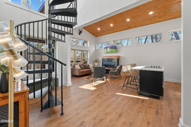 2385 Forge Hideaway Loop Unit 4, Pigeon Forge, TN 37863 - living room with stairway, recessed lighting, a fireplace, wood finished floors, and high vaulted ceiling