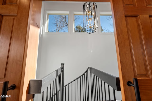 2385 Forge Hideaway Loop Unit 4, Pigeon Forge, TN 37863 - staircase featuring a chandelier