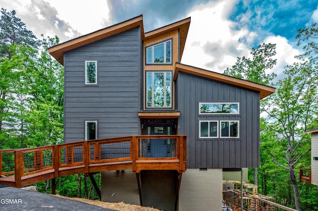 2385 Forge Hideaway Loop Unit 4, Pigeon Forge, TN 37863 - back of house with a deck and board and batten siding