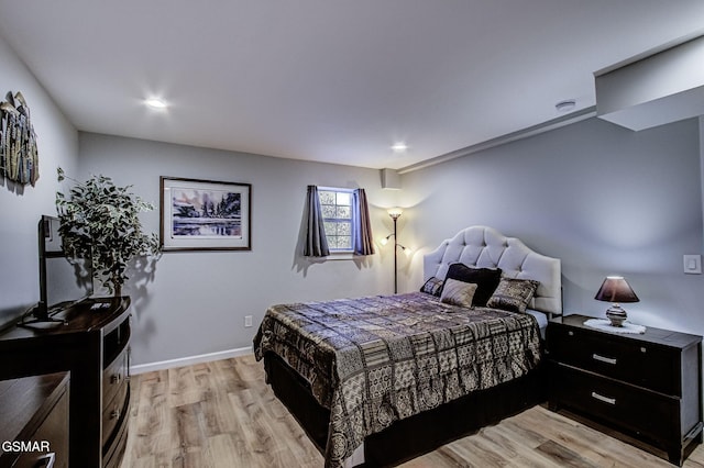 bedroom featuring recessed lighting, baseboards, and light wood finished floors