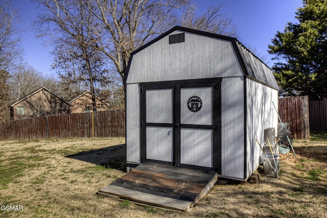 view of shed with a fenced backyard