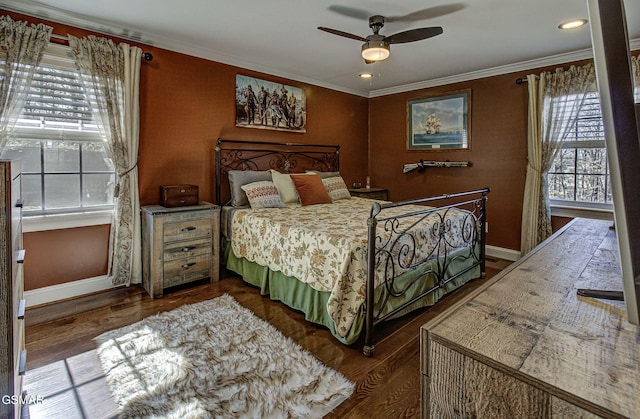 bedroom featuring ceiling fan, baseboards, dark wood-style floors, and crown molding