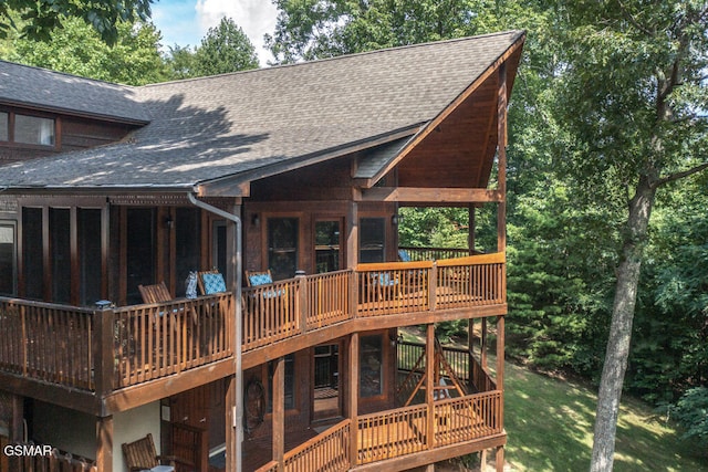 back of house with a wooden deck