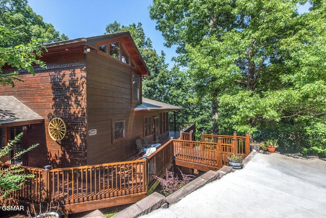 view of side of home featuring a deck