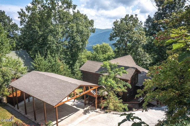 birds eye view of property with a mountain view