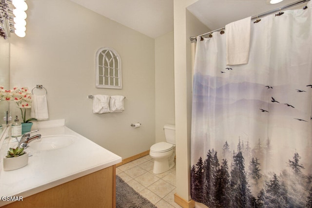 bathroom featuring vanity, tile patterned floors, toilet, and a shower with shower curtain