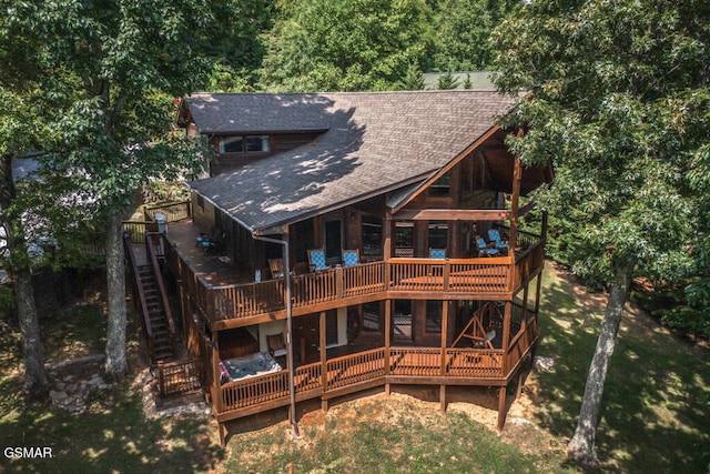 rear view of house with a deck