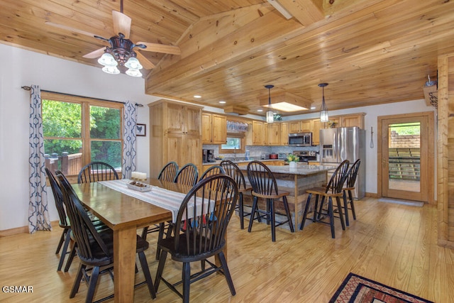 dining room featuring vaulted ceiling, wood ceiling, and light hardwood / wood-style floors