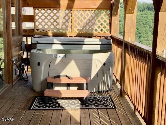 2022 Starr Crest Dr, Sevierville, TN 37876 - wooden terrace with a hot tub