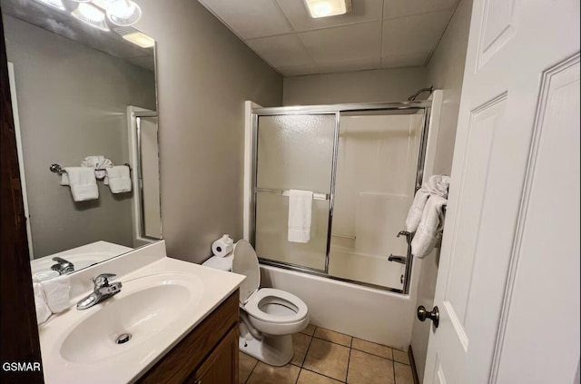 929 Smoky Ct, Gatlinburg, TN 37738 - full bathroom with vanity, toilet, tile patterned flooring, and bath / shower combo with glass door