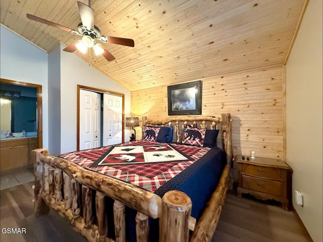 929 Smoky Ct, Gatlinburg, TN 37738 - bedroom with wood ceiling, vaulted ceiling, wood finished floors, wood walls, and a closet