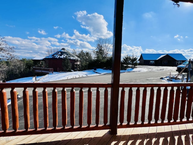 view of snow covered deck