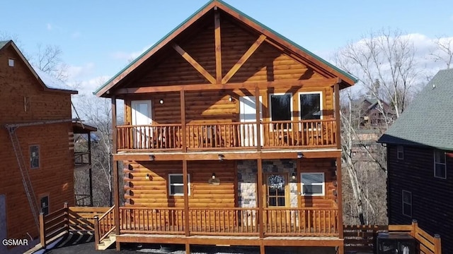 back of house with a balcony