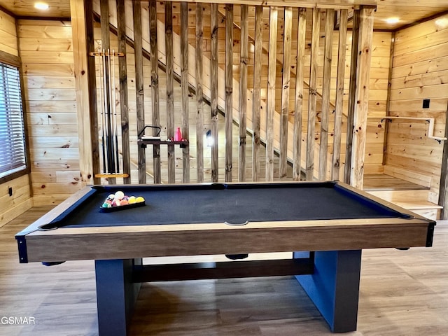 rec room featuring wooden walls, hardwood / wood-style flooring, and billiards