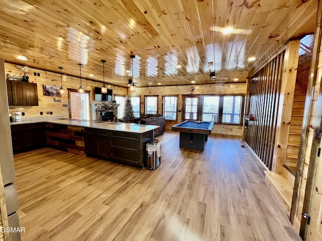 kitchen with a center island, hanging light fixtures, billiards, light hardwood / wood-style flooring, and dark brown cabinets