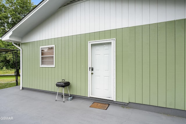 entrance to property with a patio area