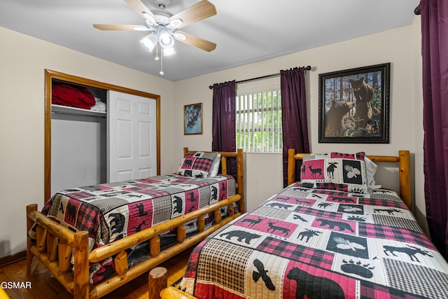 bedroom featuring hardwood / wood-style floors, a closet, and ceiling fan