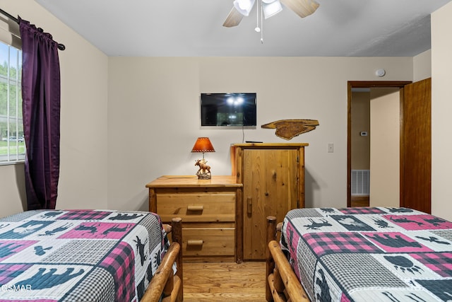 bedroom featuring ceiling fan and light hardwood / wood-style flooring